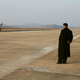 Image for article titled Kim Jong Un Visits Female Fighter Pilots, Picks Up Camera For Photo Op